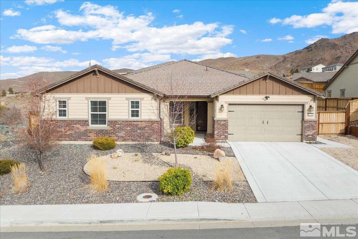 2711 McCauley Ranch Boulevard Reno, NV 89521 - Photo 2 of 40 a front view of a house with garden