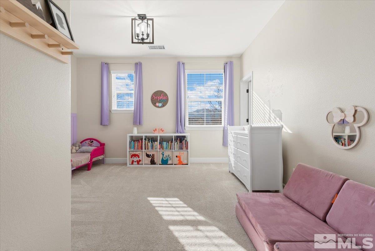 2711 McCauley Ranch Boulevard Reno, NV 89521 - Photo 24 of 40 a bedroom with furniture and a window