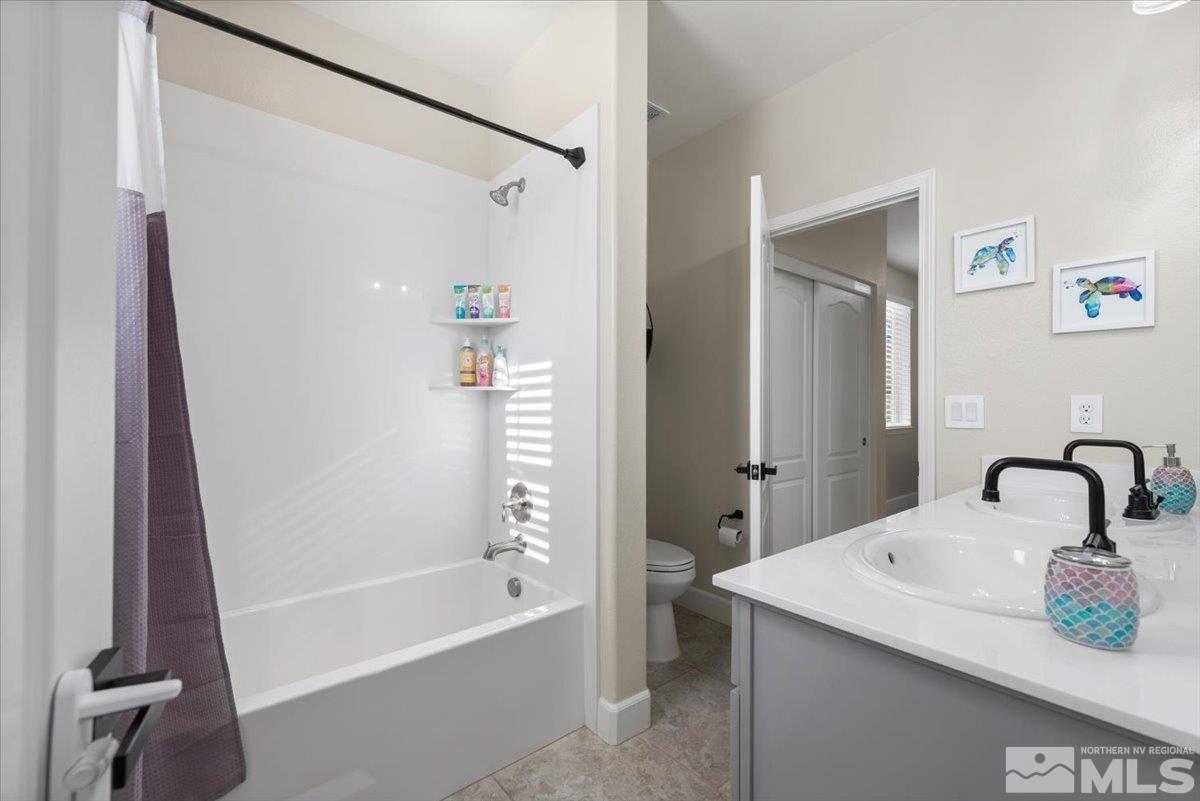 2711 McCauley Ranch Boulevard Reno, NV 89521 - Photo 27 of 40 a bathroom with a sink toilet and shower
