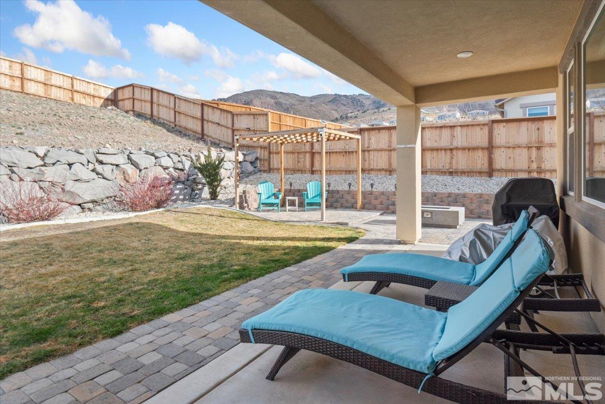 2711 McCauley Ranch Boulevard Reno, NV 89521 - Photo 35 of 40 a view of a swimming pool with a patio and a yard