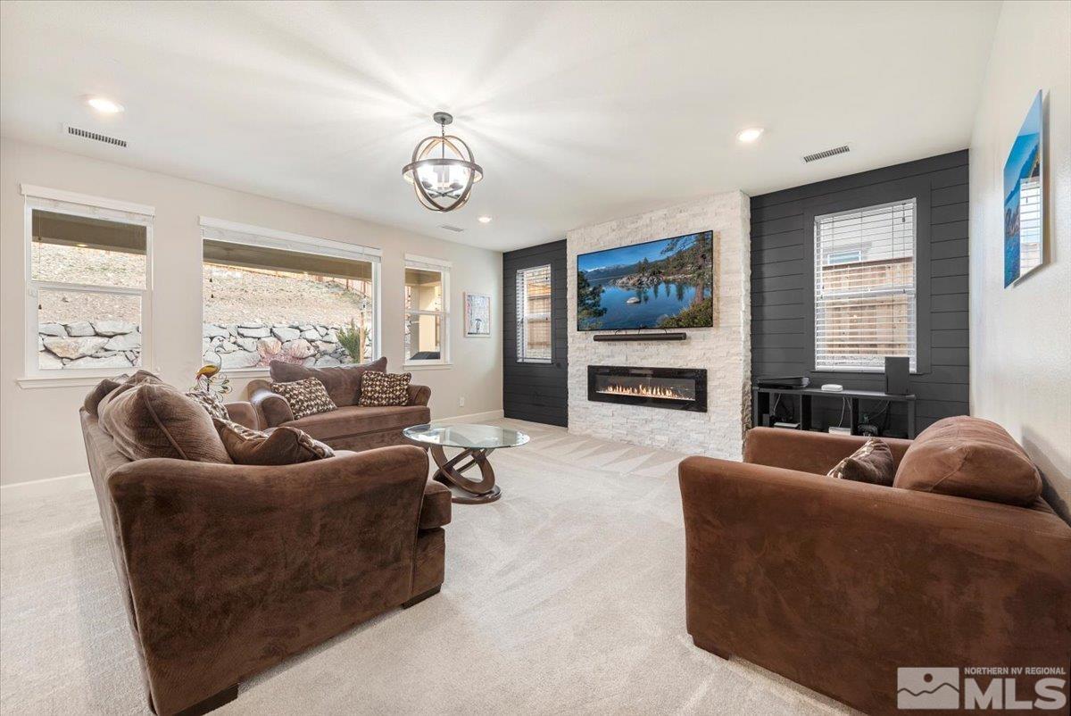 2711 McCauley Ranch Boulevard Reno, NV 89521 - Photo 6 of 40 a living room with furniture and a flat screen tv