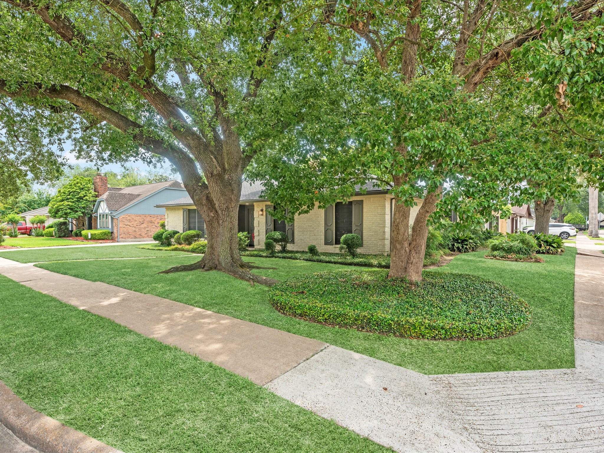 4002 Cujanes Street Pasadena, TX 77504 - Photo 3 of 26 a front view of a house with a yard