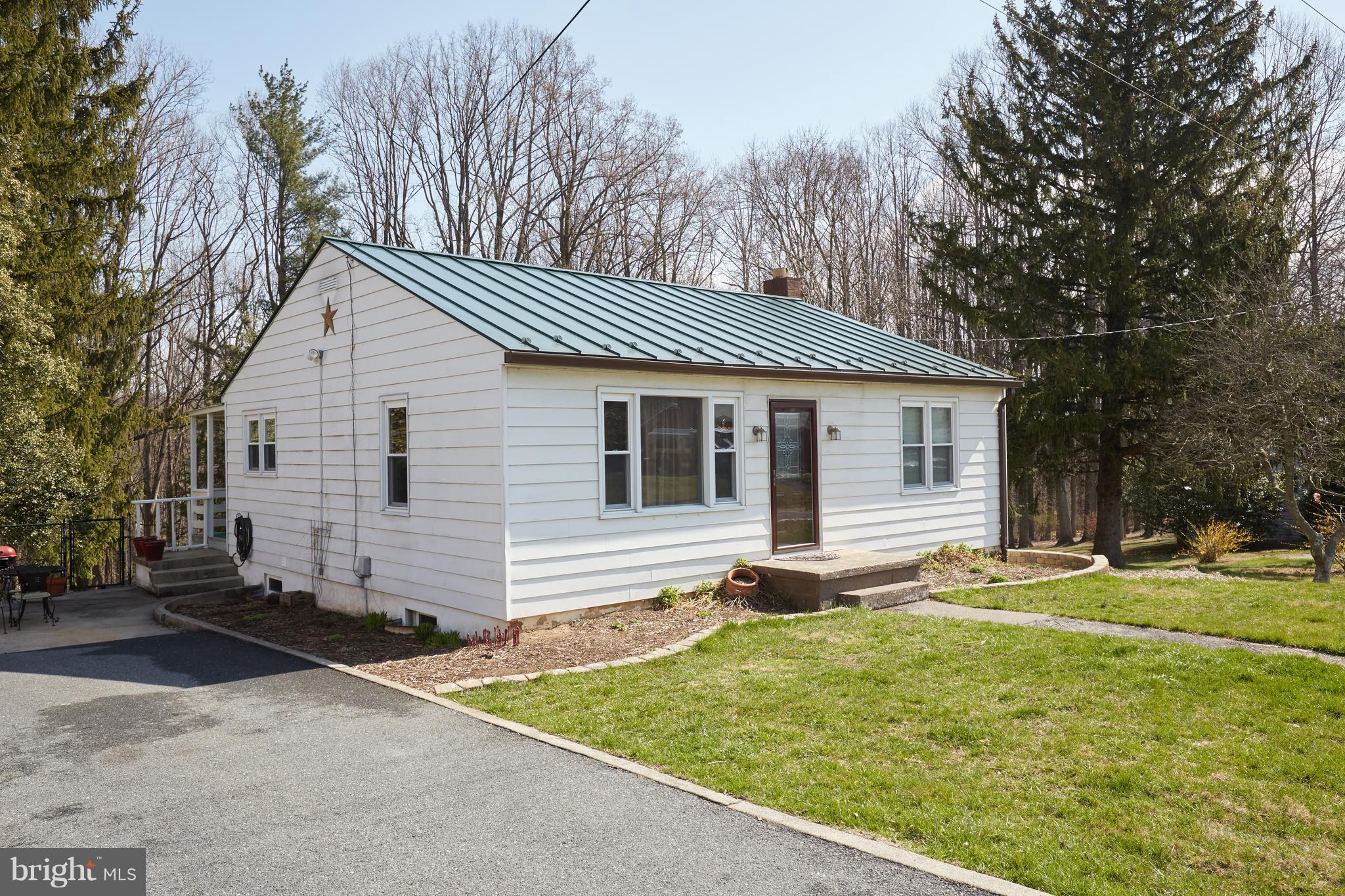 4910 Old Swimming Pool Road Frederick, MD 21703 - Photo 1 of 26 a view of a house with a yard and large tree
