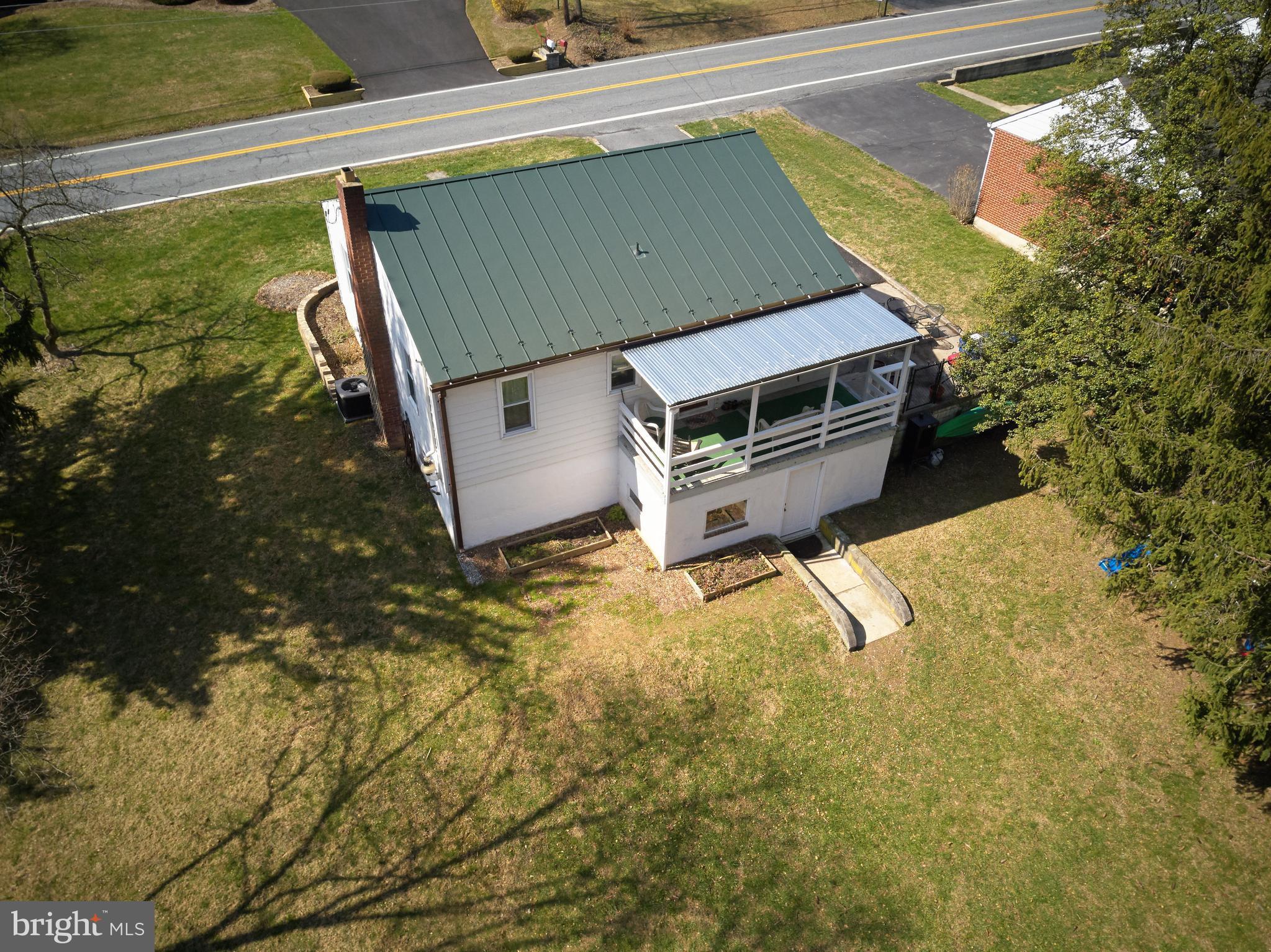 4910 Old Swimming Pool Road Frederick, MD 21703 - Photo 19 of 26 a house with trees in front of it