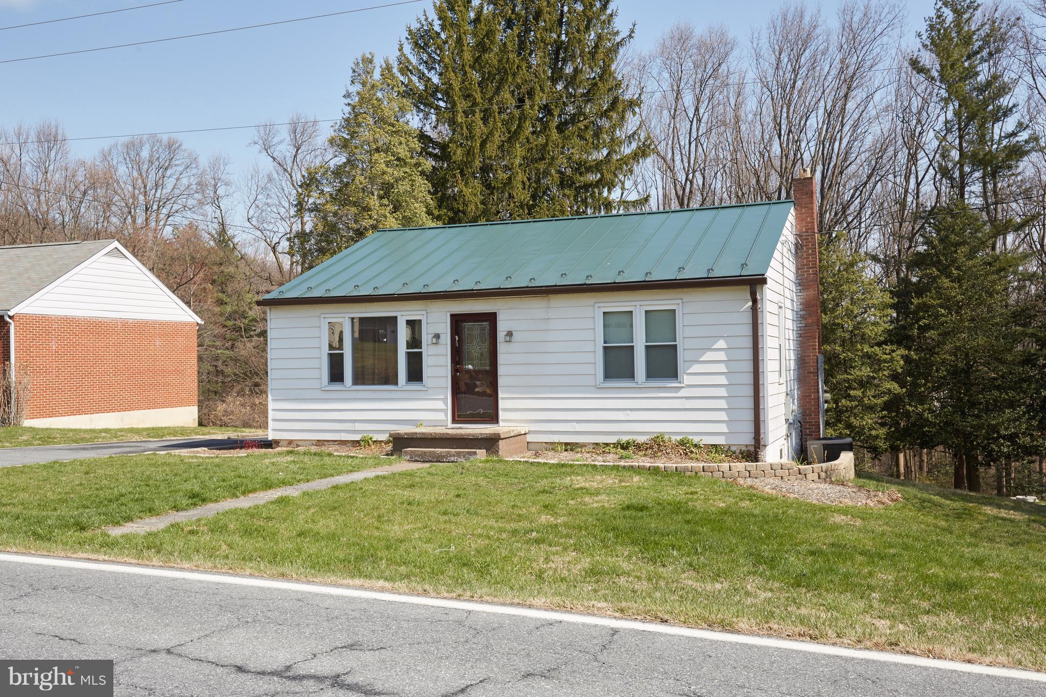 4910 Old Swimming Pool Road Frederick, MD 21703 - Photo 22 of 26 a house that has a tree in front of the house