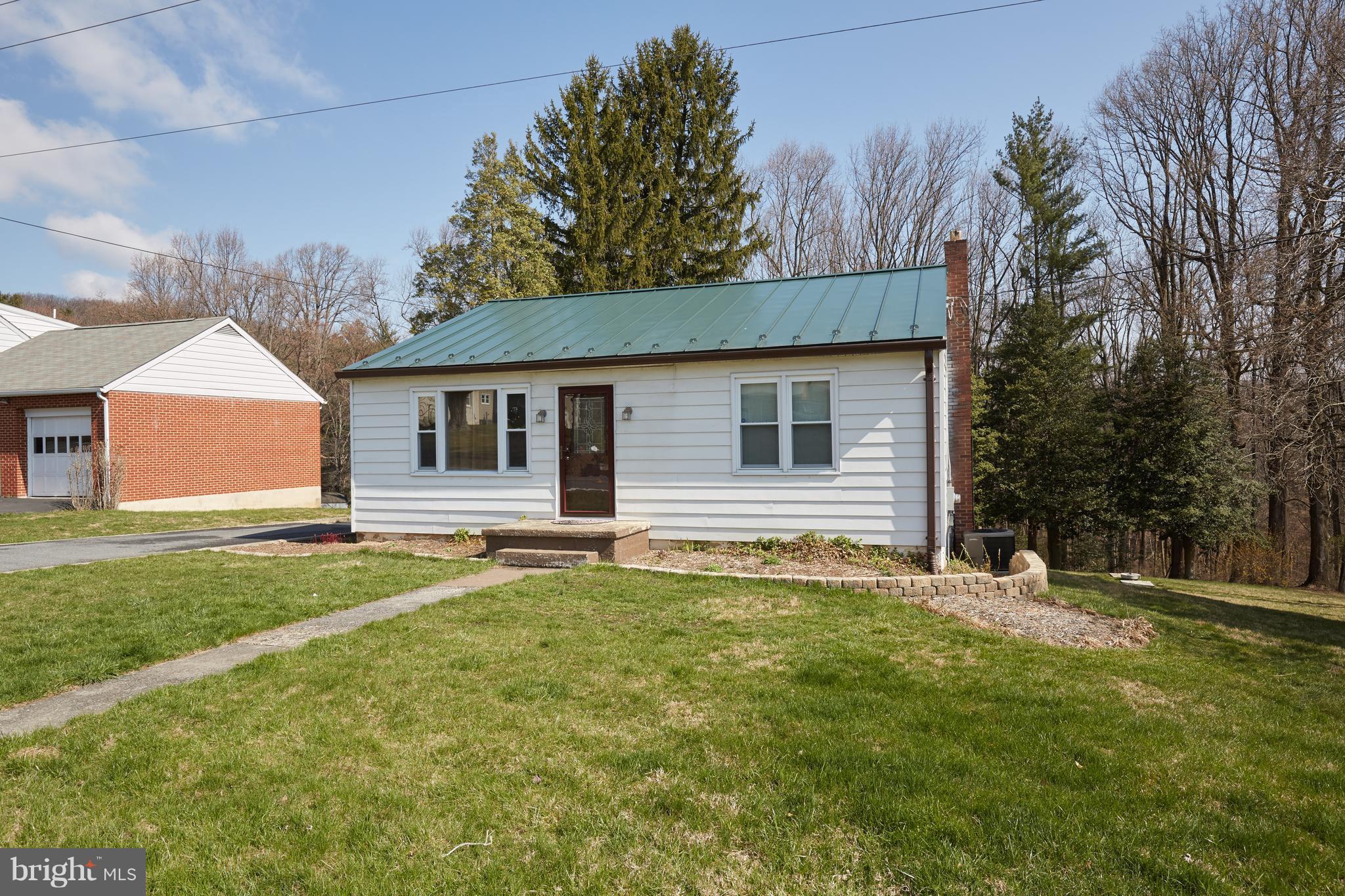 4910 Old Swimming Pool Road Frederick, MD 21703 - Photo 23 of 26 a house that has a big yard large trees with wooden fence