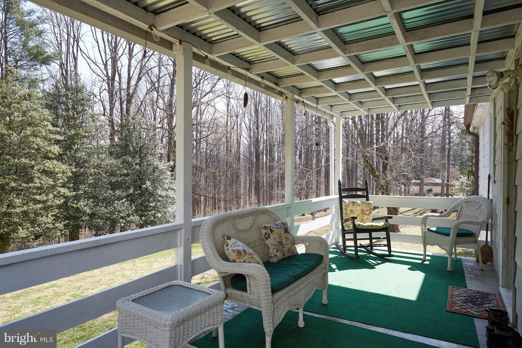 4910 Old Swimming Pool Road Frederick, MD 21703 - Photo 4 of 26 a roof deck with couches and wooden floor