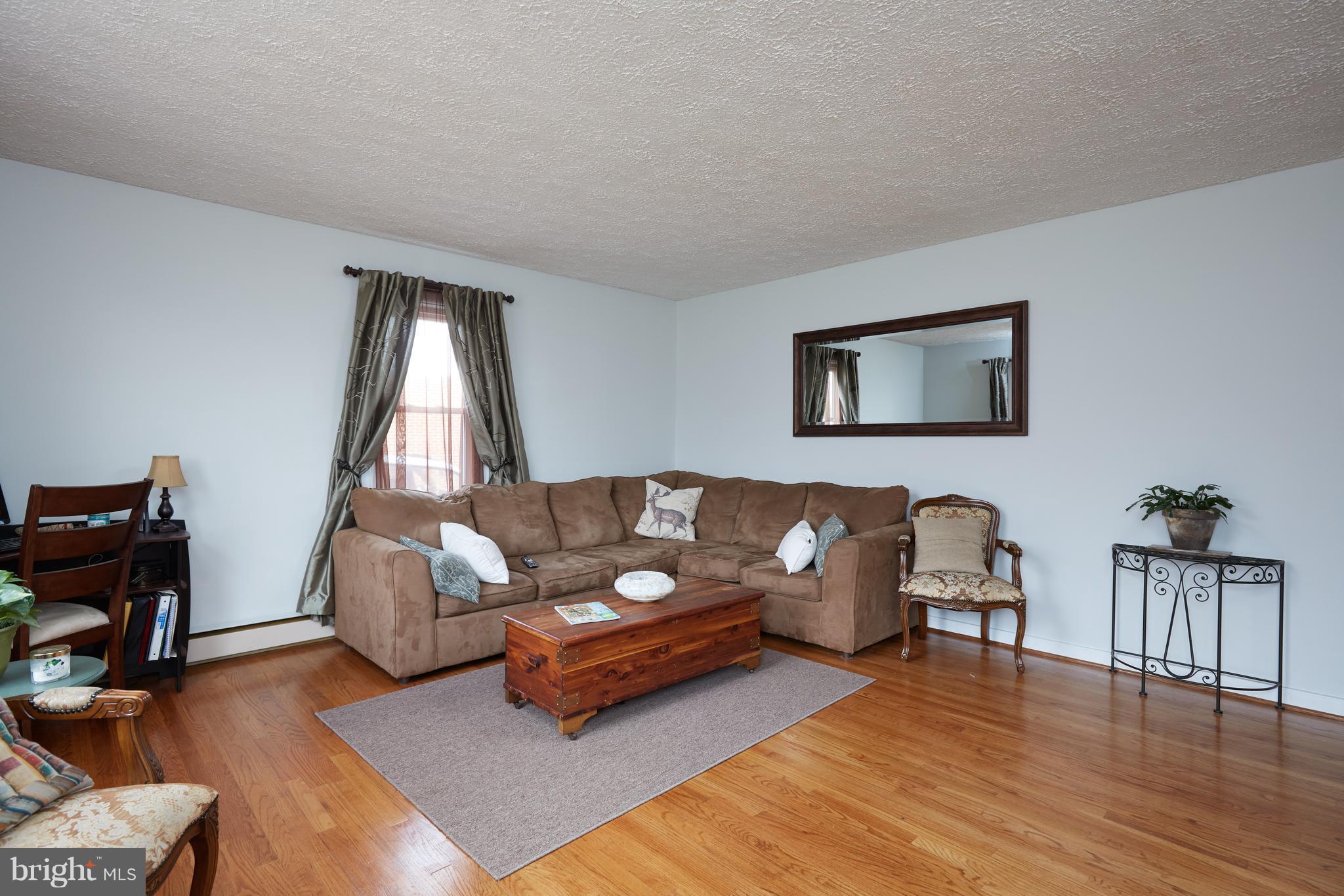 4910 Old Swimming Pool Road Frederick, MD 21703 - Photo 5 of 26 a living room with furniture and a wooden floor