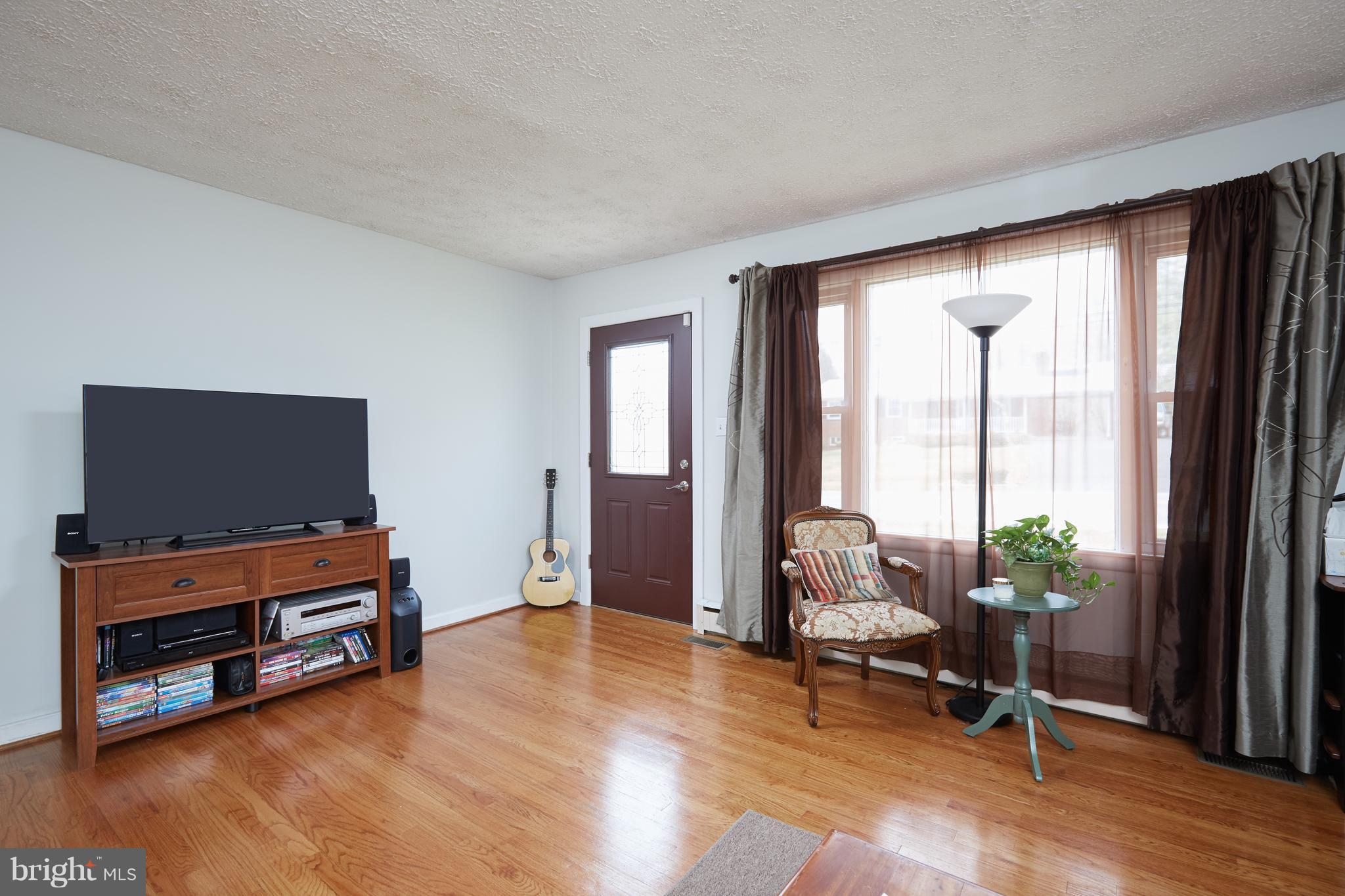 4910 Old Swimming Pool Road Frederick, MD 21703 - Photo 7 of 26 a living room with furniture and a flat screen tv