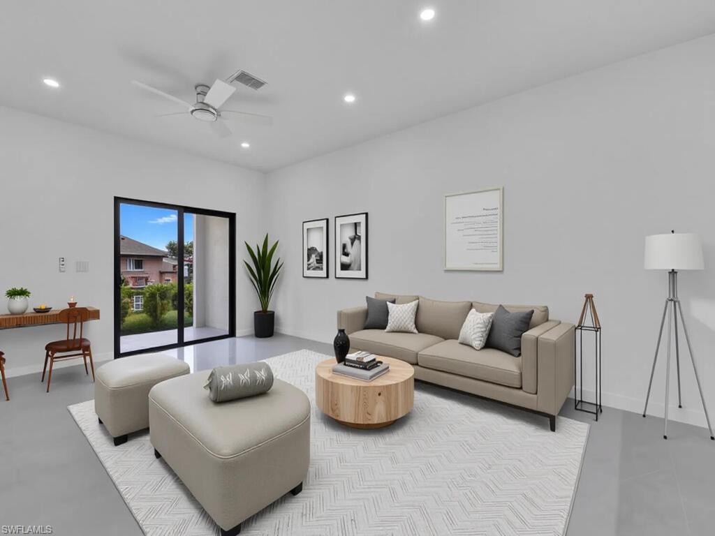4450-4452 24th Street Southwest Lehigh Acres, FL 33973 - Photo 27 of 49 a living room with furniture and a large window