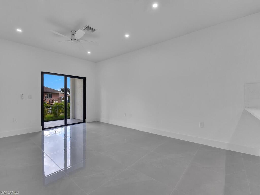 4450-4452 24th Street Southwest Lehigh Acres, FL 33973 - Photo 28 of 49 a view of an empty room with a window