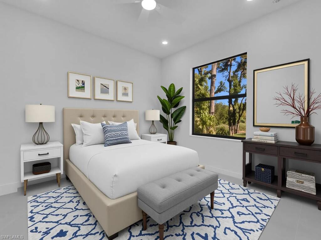 4450-4452 24th Street Southwest Lehigh Acres, FL 33973 - Photo 38 of 49 a bedroom with a bed and a desk