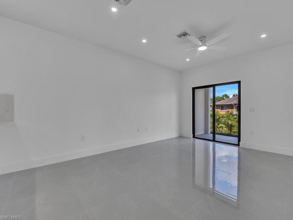 4450-4452 24th Street Southwest Lehigh Acres, FL 33973 - Photo 4 of 49 an empty room with windows and closet