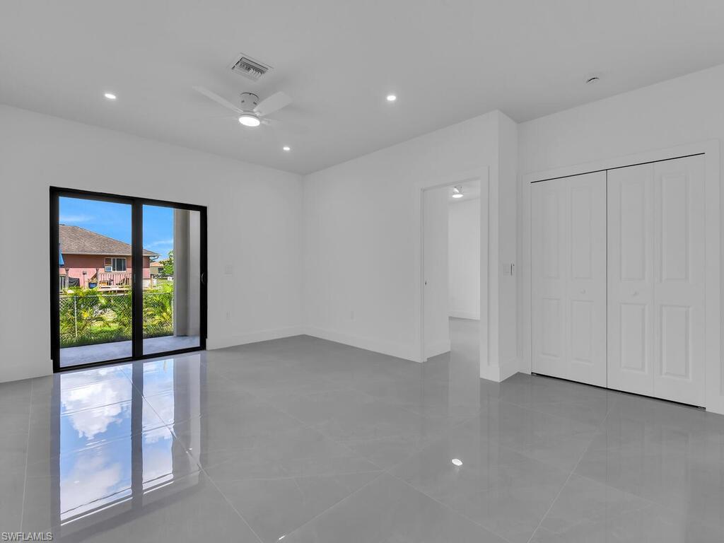 4450-4452 24th Street Southwest Lehigh Acres, FL 33973 - Photo 10 of 49 a view of an empty room with a window