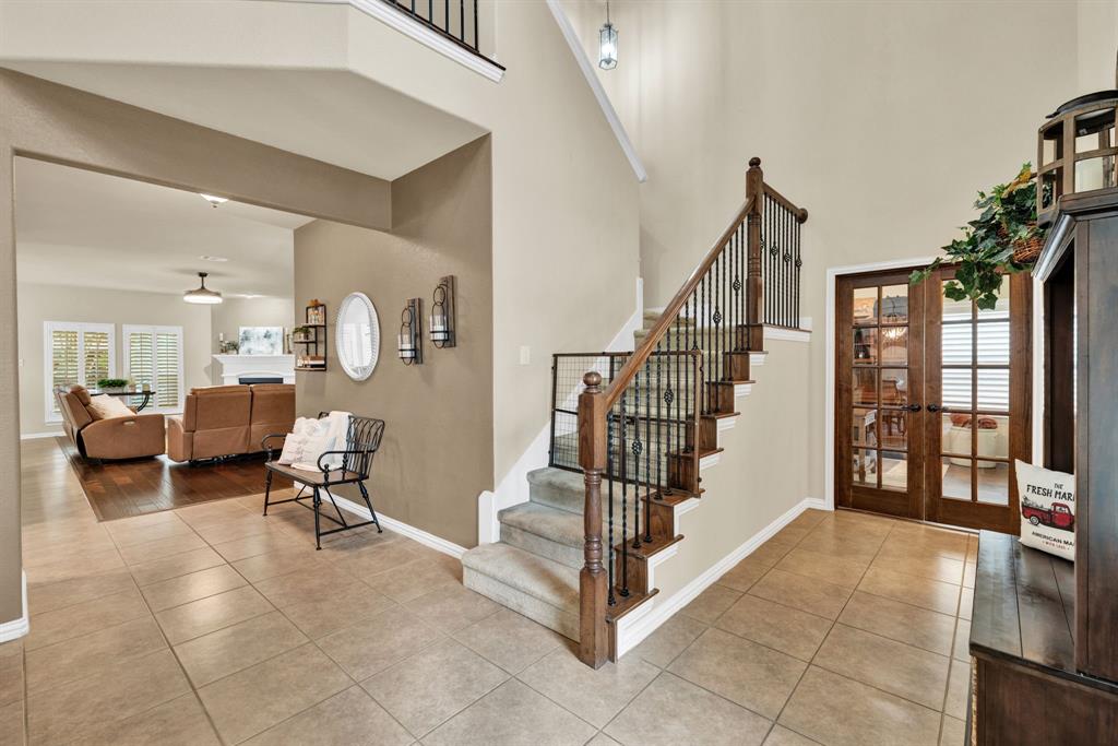 1701 Meadow Ranch Road McKinney, TX 75071 - Photo 21 of 40 a living room with furniture and a floor to ceiling window