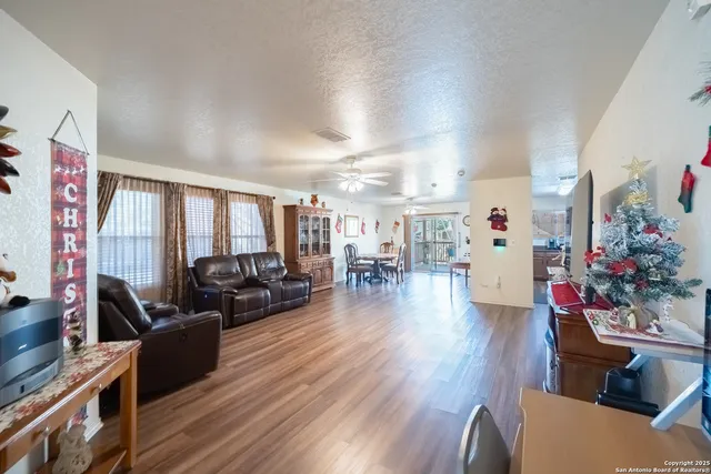 a kitchen with stainless steel appliances granite countertop lots of counter top space and wooden floor