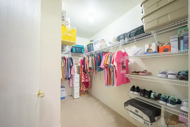 a spacious bathroom with a sink a toilet and a shower