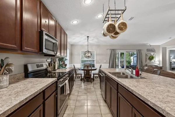 a kitchen with a counter space cabinets and stainless steel appliances