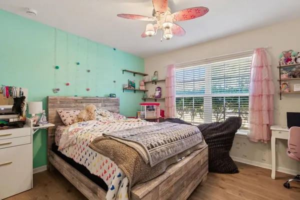 a bedroom with a bed and a table