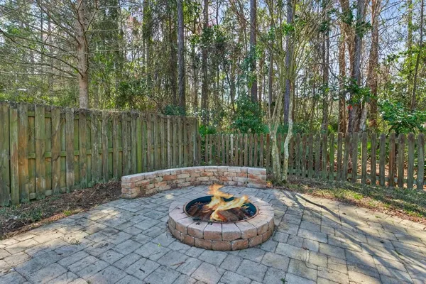 a view of a backyard with a small water and a fountain
