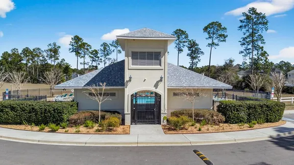 an aerial view of residential house with outdoor space