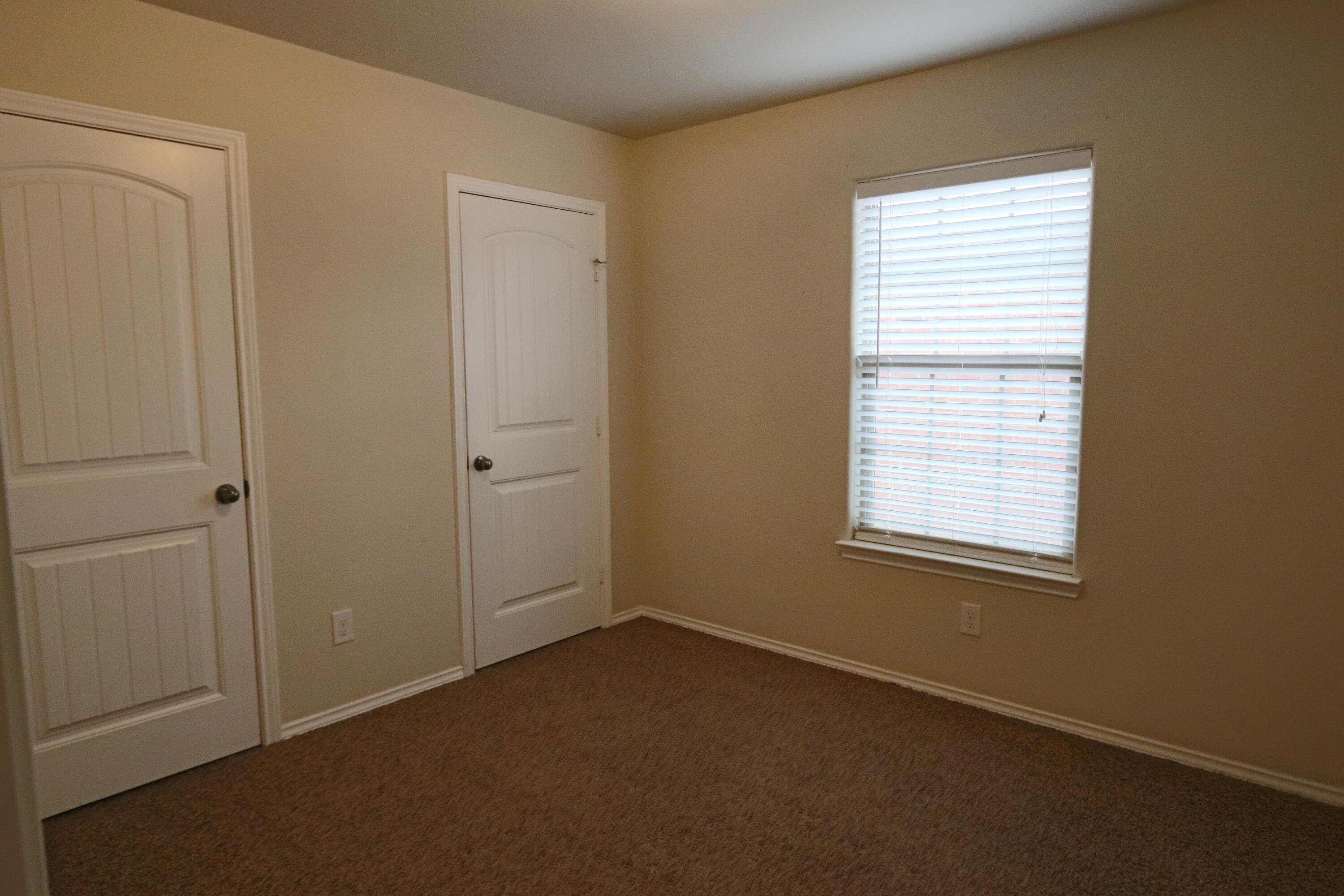 6810 83rd Street Lubbock, TX 79424 - Photo 7 of 9 an empty room with a window