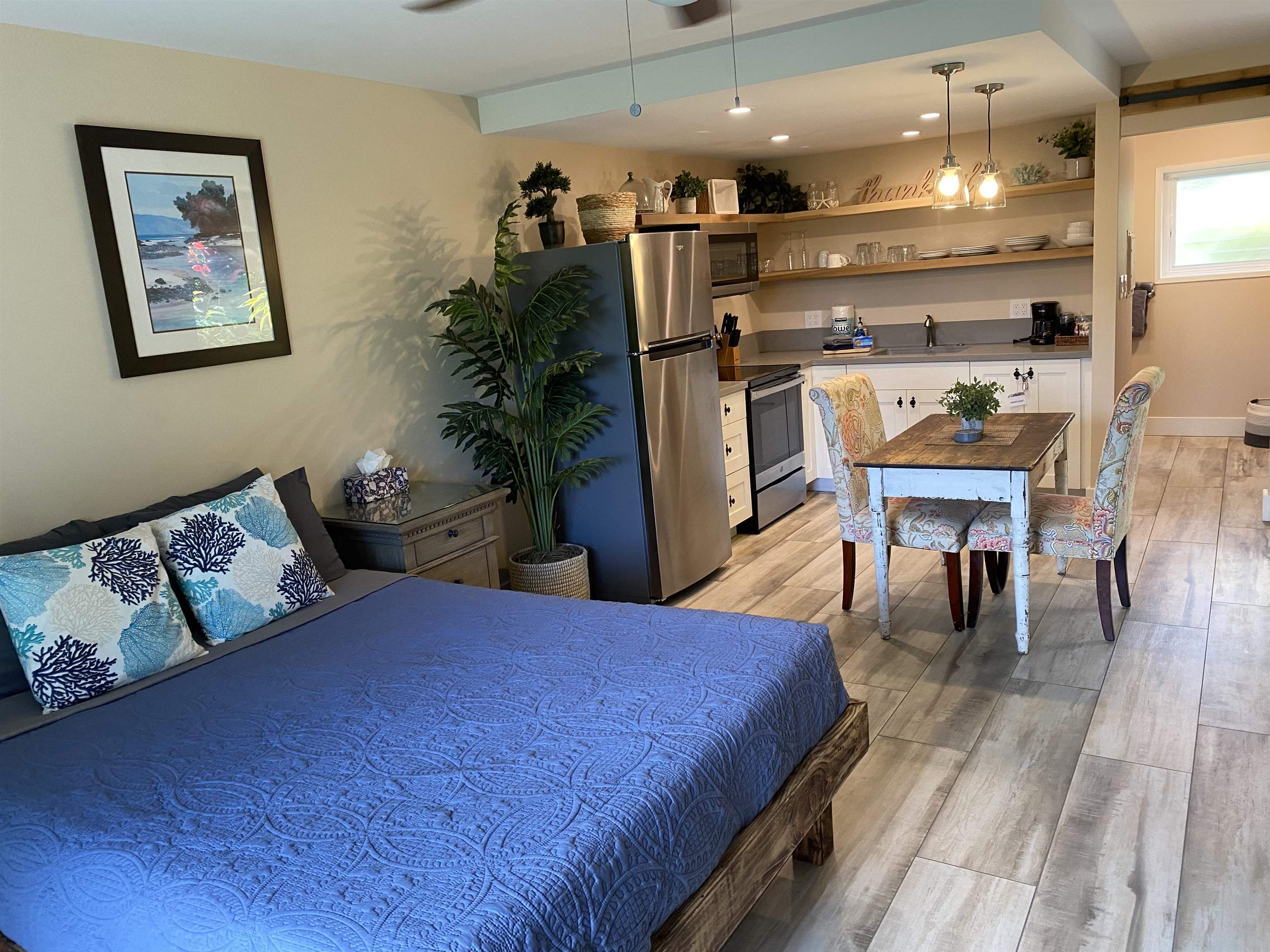 120 Hui F Road, Unit J1 Lahaina, HI 96761 - Photo 1 of 36 a living room with furniture a dining table and kitchen view