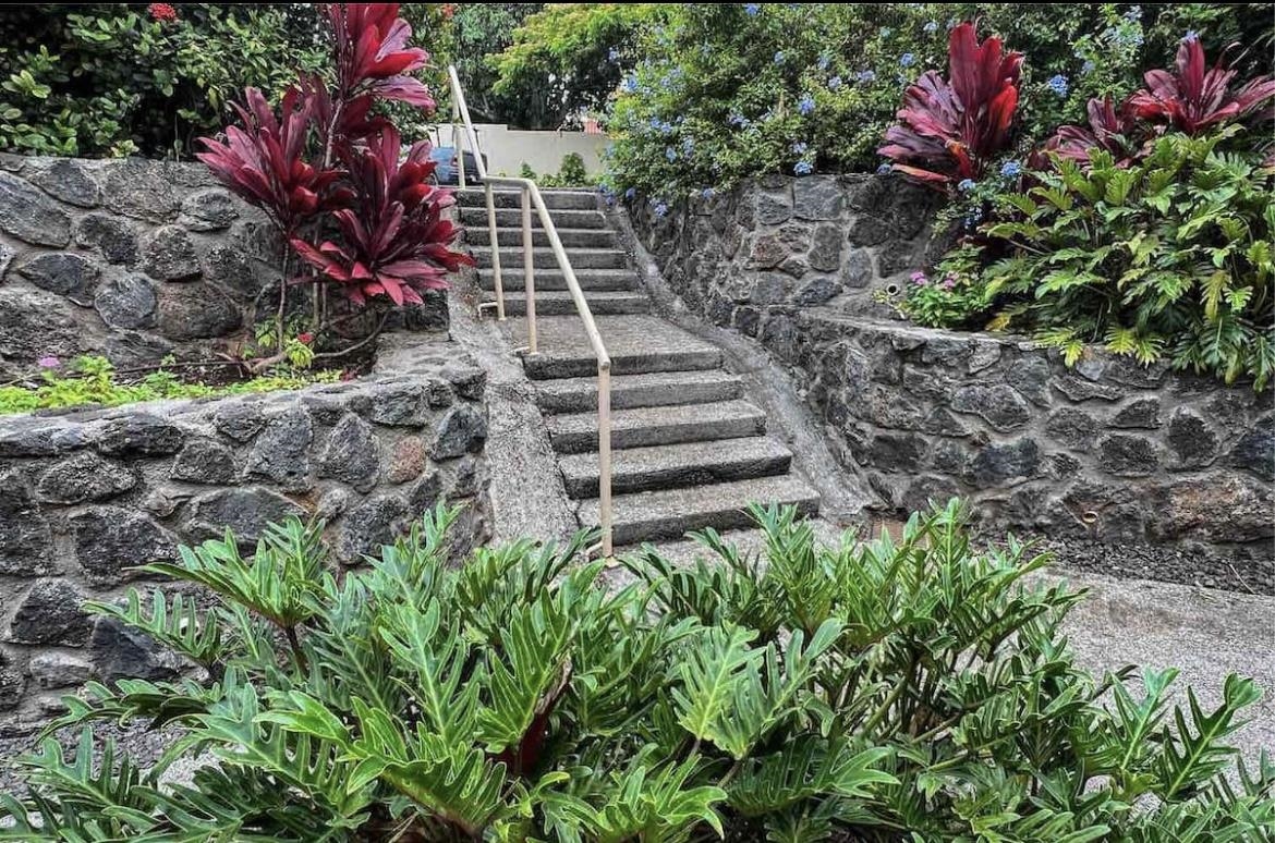 120 Hui F Road, Unit J1 Lahaina, HI 96761 - Photo 19 of 36 a view of a garden with flowers