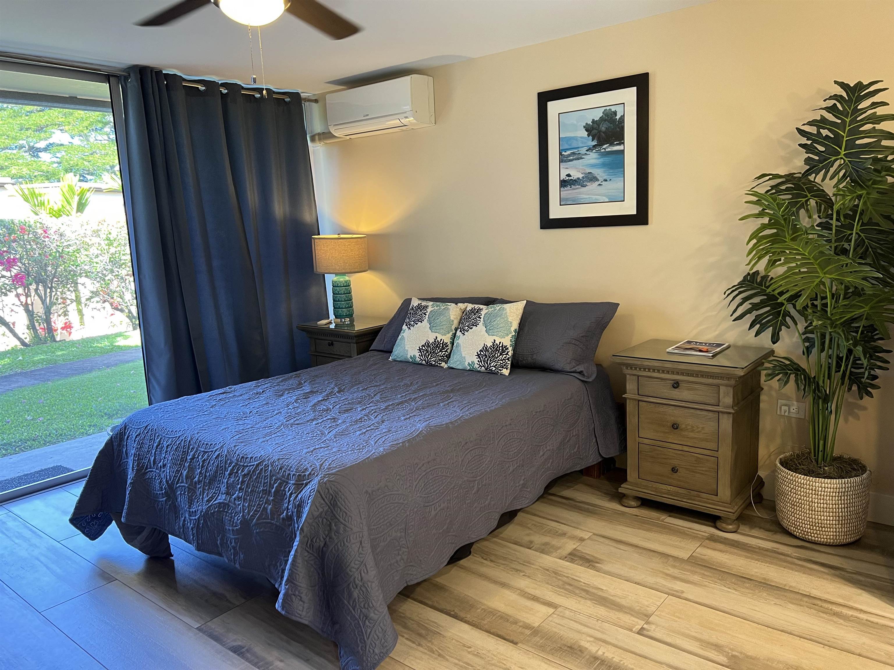 120 Hui F Road, Unit J1 Lahaina, HI 96761 - Photo 2 of 36 a bedroom with a bed and a window