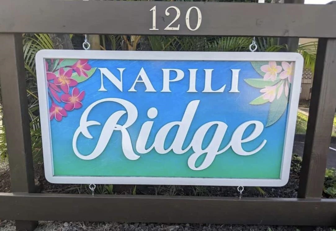 120 Hui F Road, Unit J1 Lahaina, HI 96761 - Photo 21 of 36 a street sign on a wall