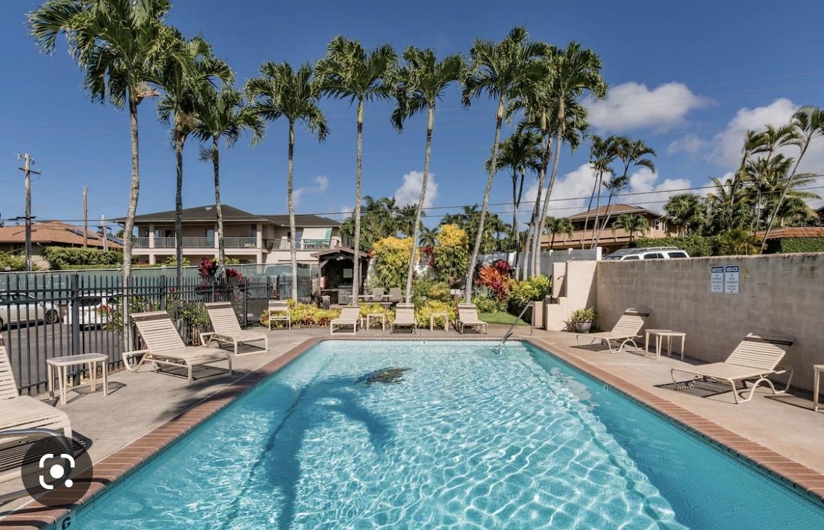 120 Hui F Road, Unit J1 Lahaina, HI 96761 - Photo 30 of 36 a view of a chairs and table in patio with a lake view
