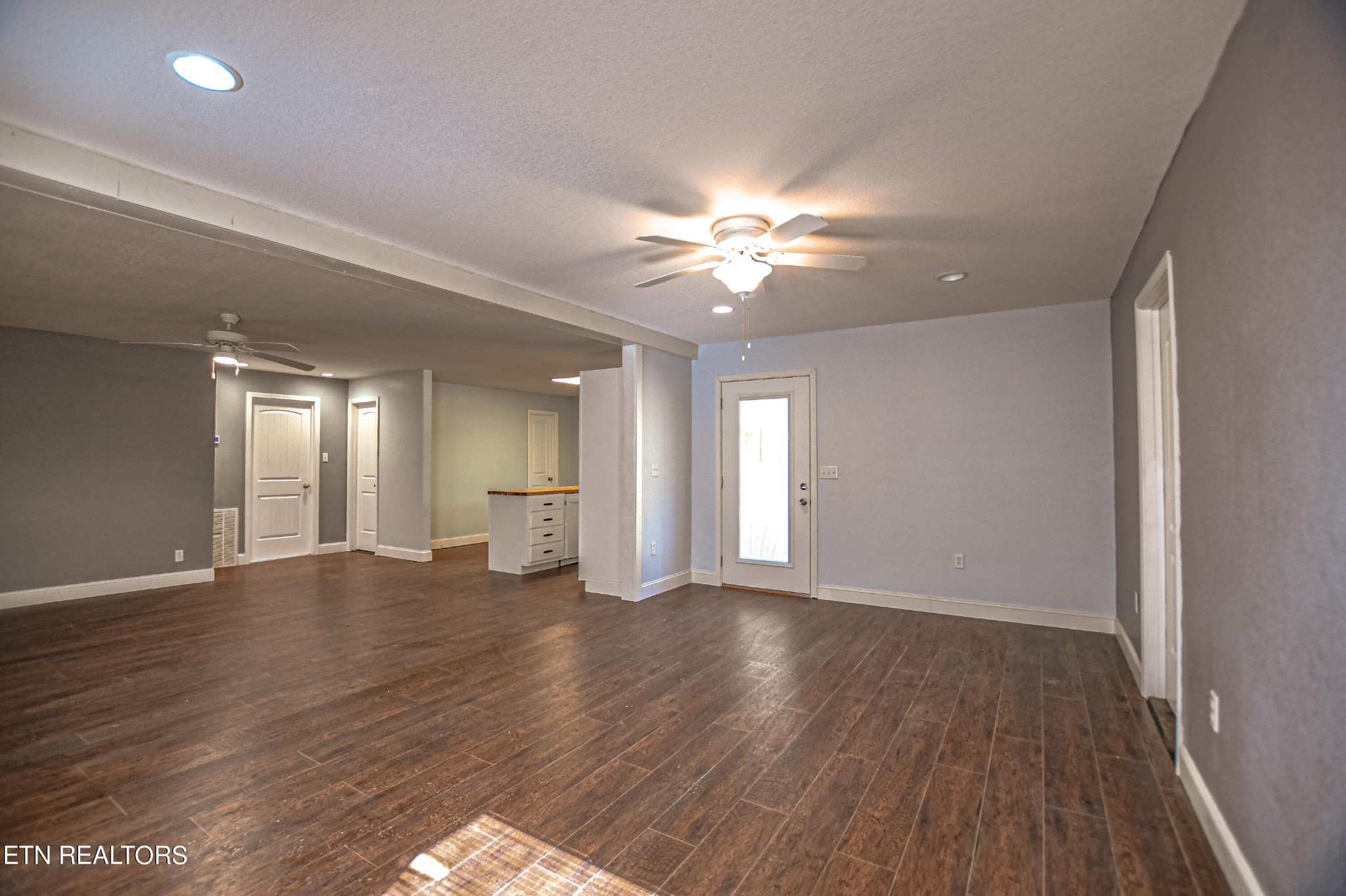 4091 Pleasant Grove Road Winfield, TN 37892 - Photo 7 of 28 a view of an empty room with window and wooden floor
