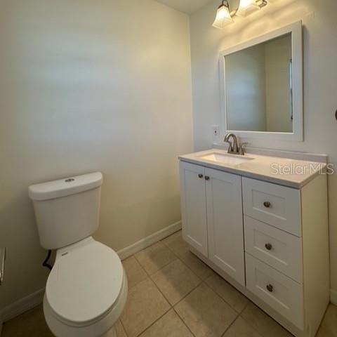 525 South Conway Road, Unit 51 Orlando, FL 32807 - Photo 12 of 18 a bathroom with a toilet sink and mirror