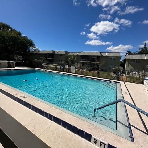 525 South Conway Road, Unit 51 Orlando, FL 32807 - Photo 14 of 18 a view of outdoor space and swimming pool