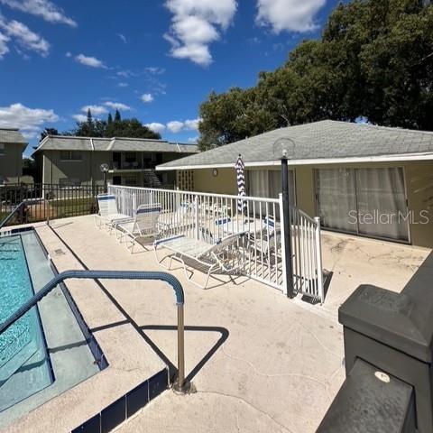 525 South Conway Road, Unit 51 Orlando, FL 32807 - Photo 15 of 18 a view of a patio with couches table and chairs