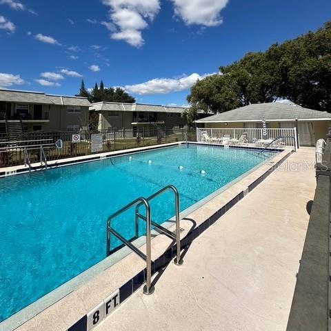 525 South Conway Road, Unit 51 Orlando, FL 32807 - Photo 16 of 18 a view of swimming pool with seating area and furniture