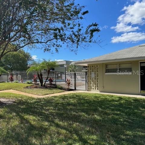 525 South Conway Road, Unit 51 Orlando, FL 32807 - Photo 17 of 18 a front view of a house with a yard and garage