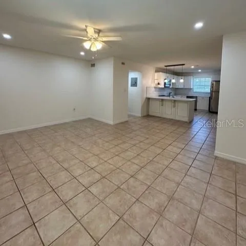 a view of kitchen and hallway with chandelier