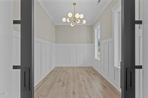 wooden floor in a livingroom with a window