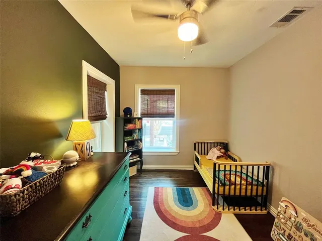 a bedroom with furniture and a window