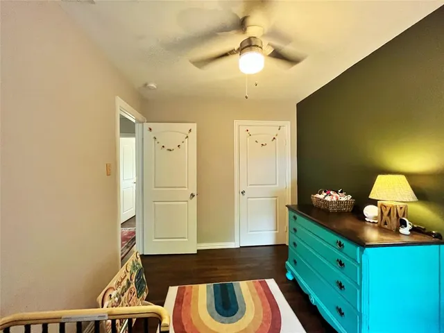 a spacious bathroom with a double vanity sink and a mirror