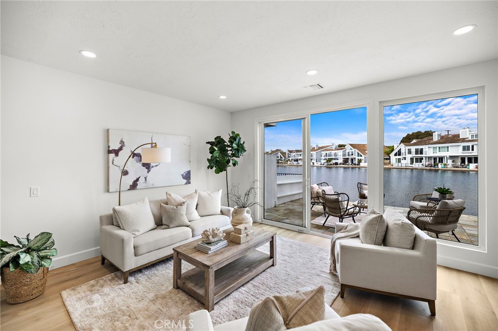 16103 St Croix Circle Huntington Beach, CA 92649 - Photo 11 of 40 a living room with furniture and a large window