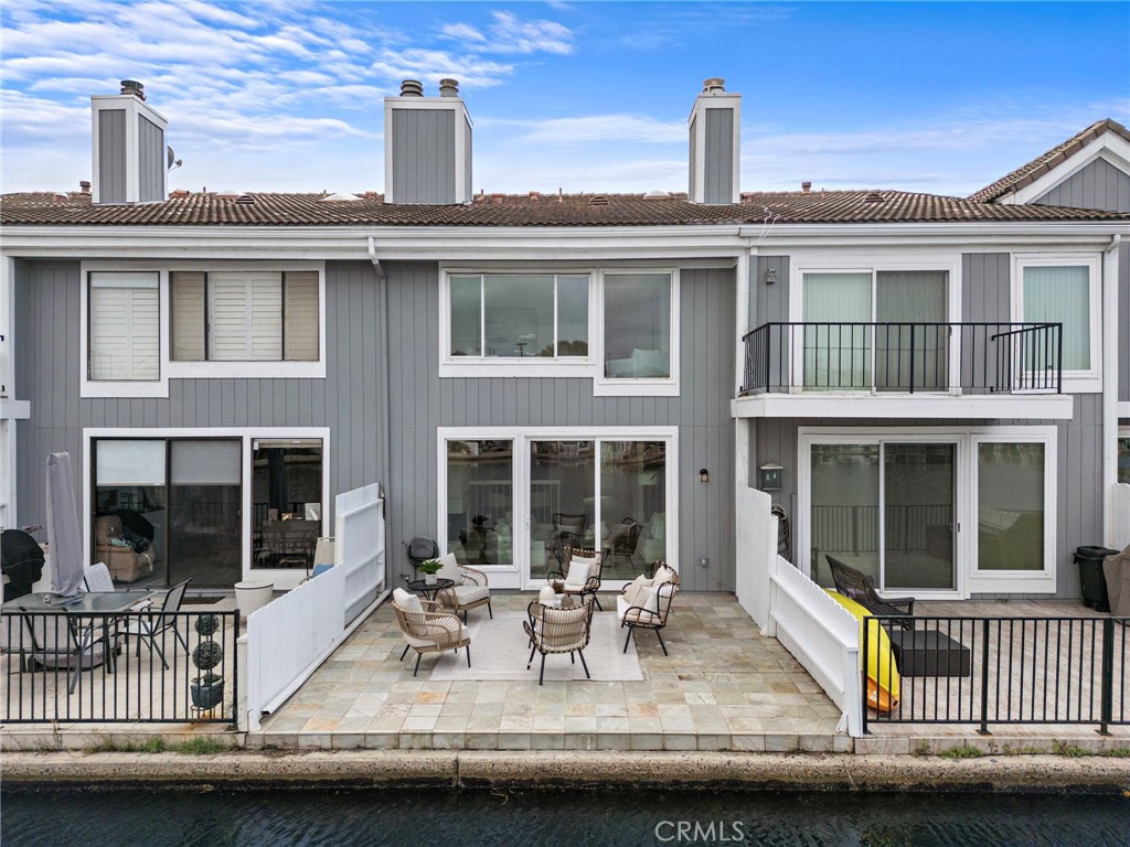16103 St Croix Circle Huntington Beach, CA 92649 - Photo 13 of 40 a view of a house with a balcony and sitting space