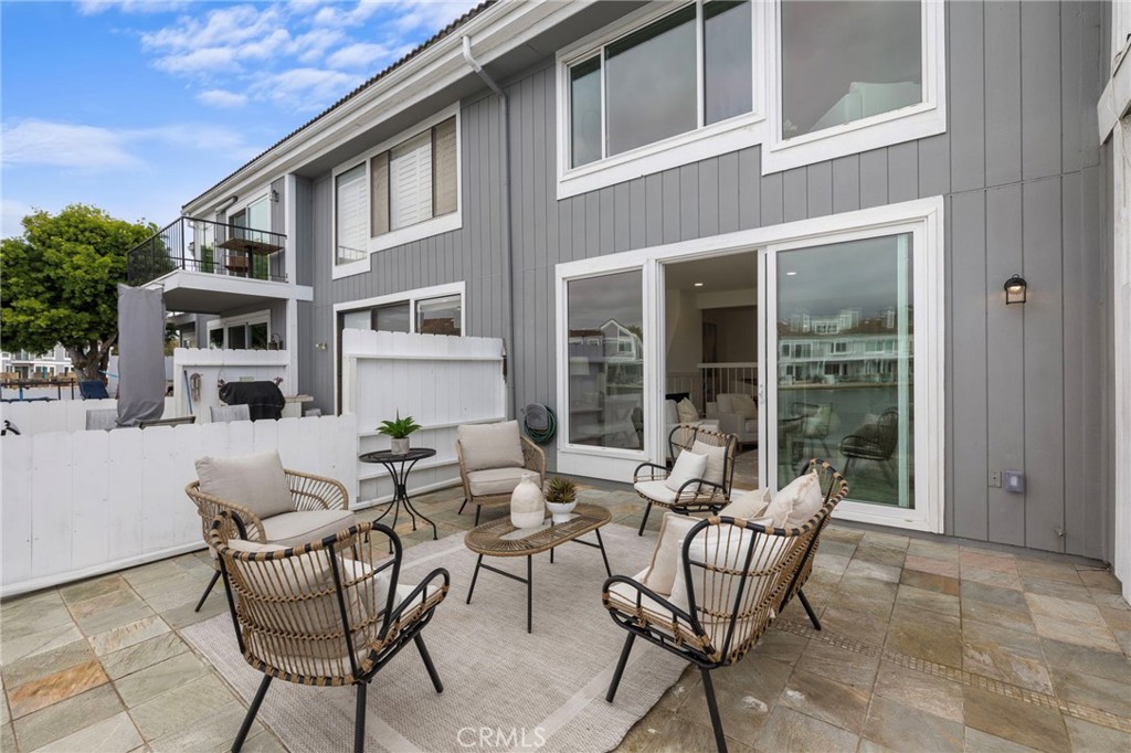 16103 St Croix Circle Huntington Beach, CA 92649 - Photo 16 of 40 a building outdoor space with patio furniture and potted plants