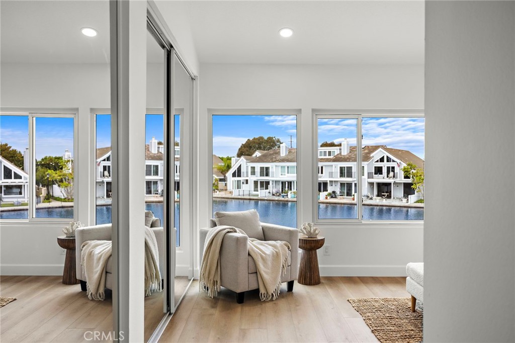16103 St Croix Circle Huntington Beach, CA 92649 - Photo 23 of 40 a living room with furniture and a book shelf