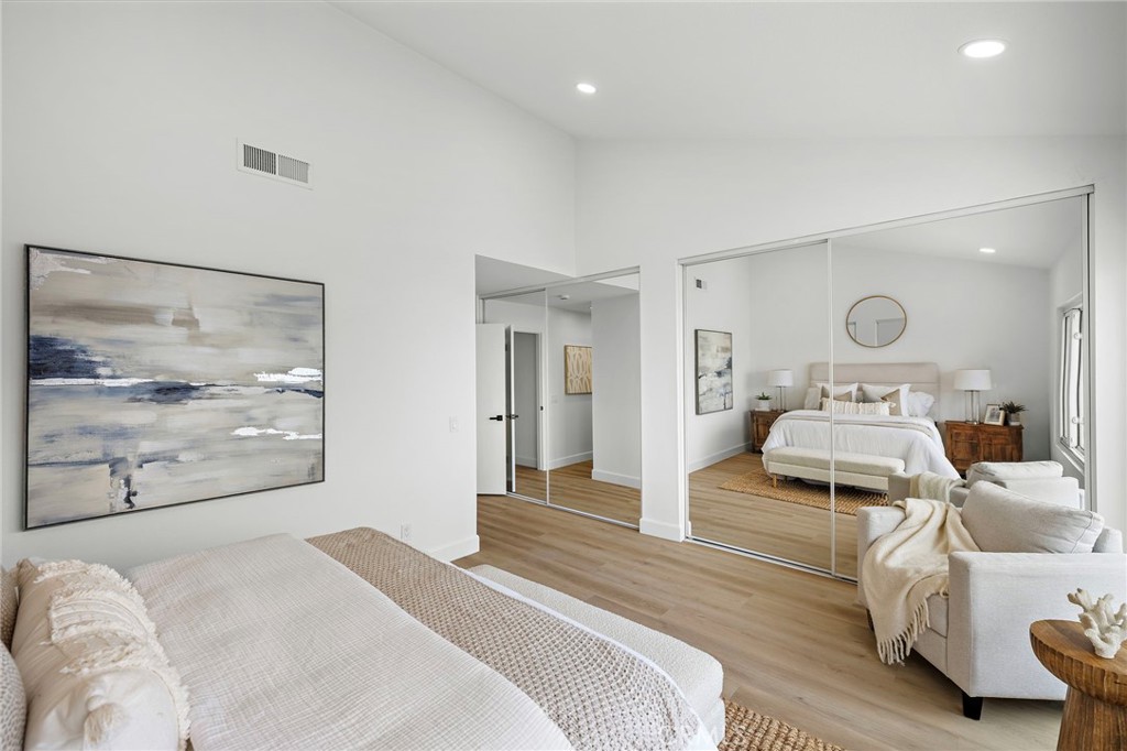 16103 St Croix Circle Huntington Beach, CA 92649 - Photo 28 of 40 a bedroom with furniture and a large mirror