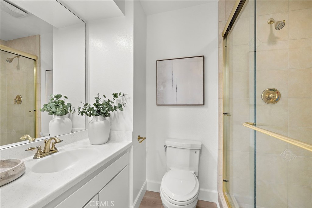 16103 St Croix Circle Huntington Beach, CA 92649 - Photo 30 of 40 a bathroom with a sink a toilet and shower