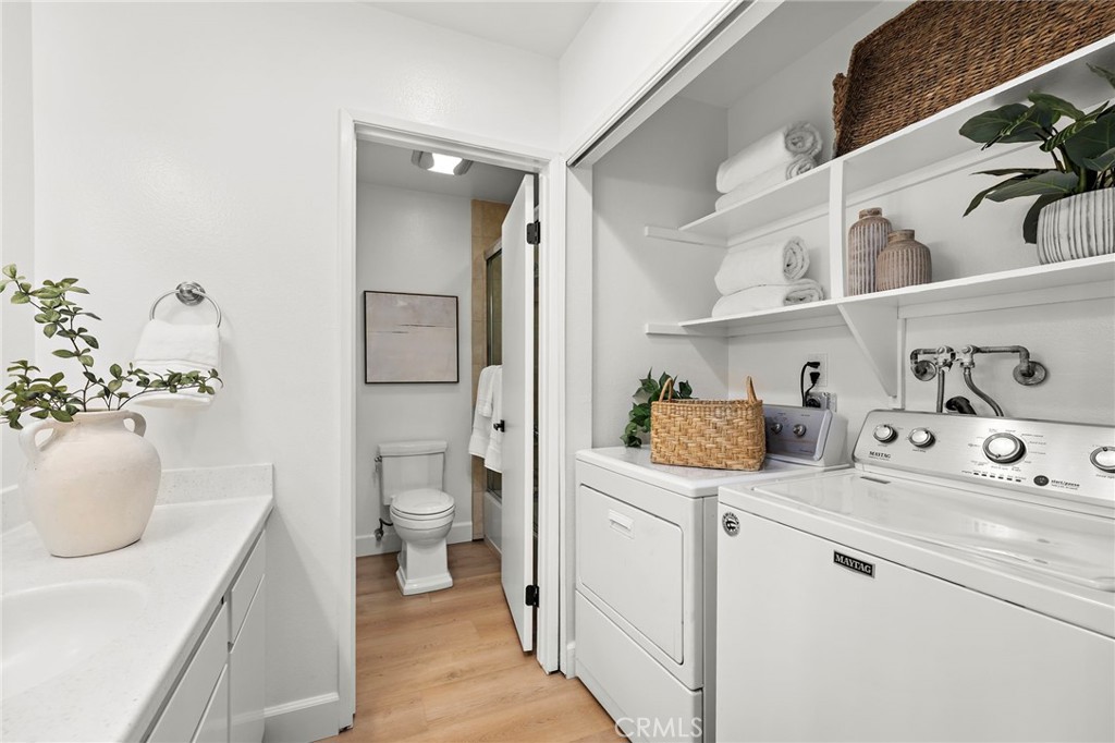 16103 St Croix Circle Huntington Beach, CA 92649 - Photo 32 of 40 a bathroom with a sink toilet and vanity