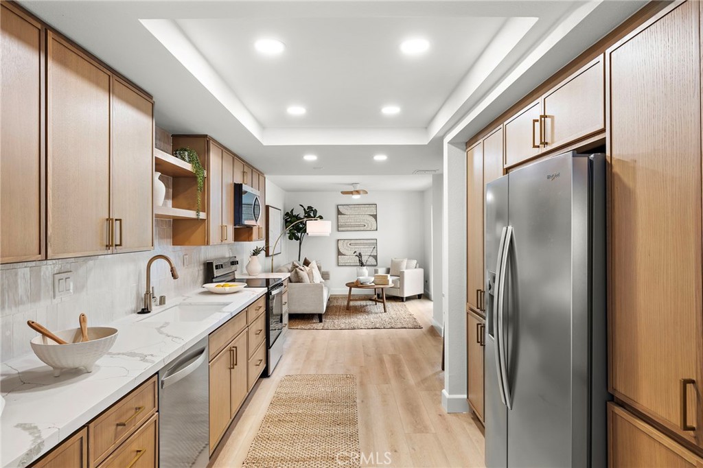 16103 St Croix Circle Huntington Beach, CA 92649 - Photo 5 of 40 a spacious bathroom with a double vanity sink and mirror