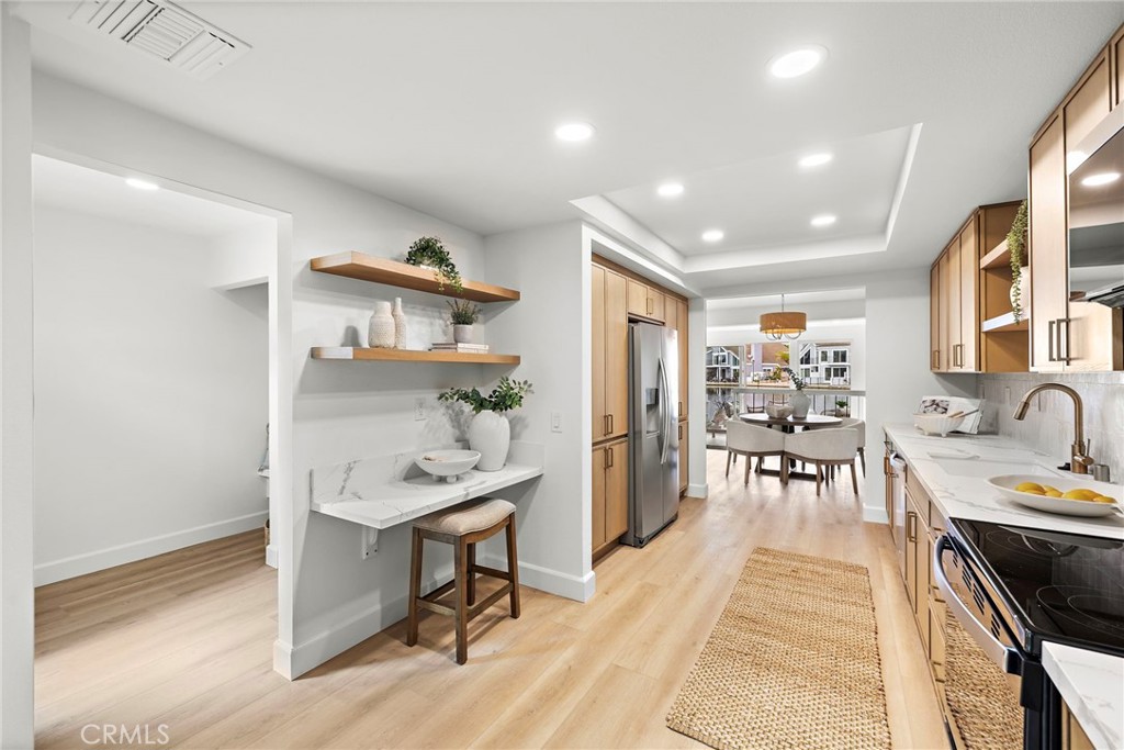 16103 St Croix Circle Huntington Beach, CA 92649 - Photo 9 of 40 a workspace with furniture